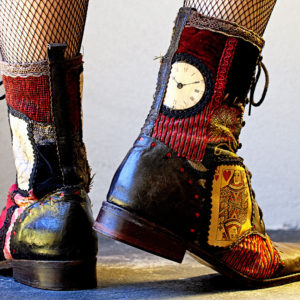 Handmade patchwork boots inspired by Alice in Wonderland, showcasing whimsical designs and vibrant colors